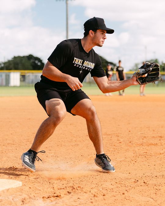 TNXL infielder set in a ready stance on the dirt