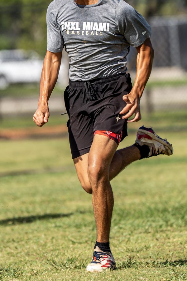 Athlete sprinting on grass